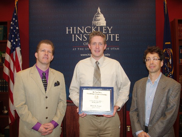 Dr. Tim Martin (l), chapter president, and Dr. Steven E. Lobell (r), professor of political science, present a grant for $5,000 to Capt. Brent R. Taylor, USA, a Ph.D. student at the University of Utah and winner of the AFCEA Educational Foundation Fall 2013 Intelligence Graduate Scholarship. The chapter presented the scholarship at the university's Hinckley Institute of Politics in January.